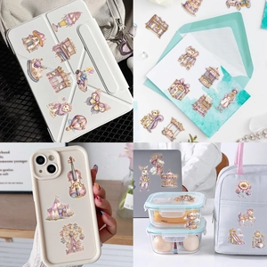 Detailed view of pink fantasy carnival stickers applied on iPad cases and phone cases