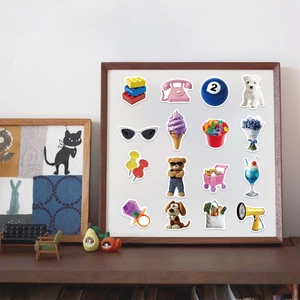 Detailed view of 16 assorted Y2K style stickers displayed in a vintage wooden frame