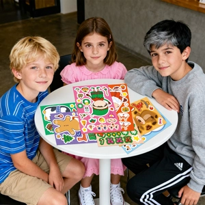 Close-up of kids playing with various Christmas make-a-face cartoon sticker sets