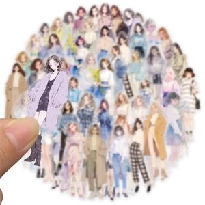 Close-up showing a hand holding a PET sticker of a Korean style girl for scrapbooking