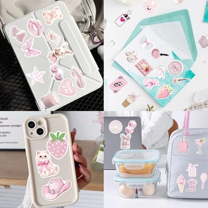 Pink aesthetic stickers on tablet and phone case with cute cat and rabbit designs