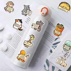 Autocollants d'animaux mignons avec phrases motivantes sur une gourde isotherme blanche