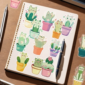 Detail shot of cute cat and cactus transparent PET stickers on a notebook with a pen