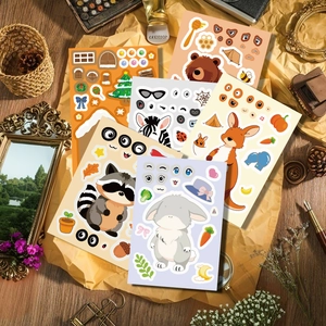Detailed view of six animal face-changing stickers for kids DIY on a vintage wood desk