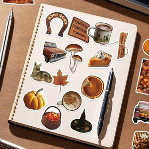 Detail showing autumn ins style stickers with pumpkins and coffee on a vintage notebook