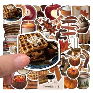 Macro detail of autumn stickers featuring waffles and pumpkins for journaling