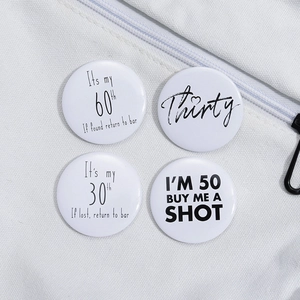 Set of four white tinplate badges with humorous birthday party quotes for age 30 50 and 60