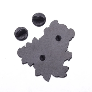 Detailed back view of enamel hamster pin showing black metal texture and double rubber pin backs