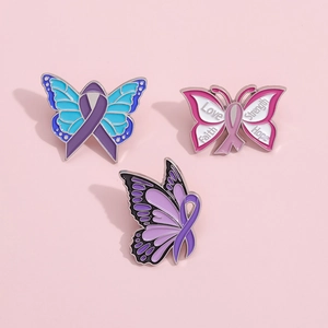 Trois pin's papillon colorés en émail avec rubans de sensibilisation et mots inspirants
