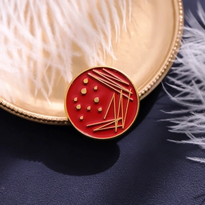 Creative red enamel round brooch with gold constellation patterns for laboratory science fans