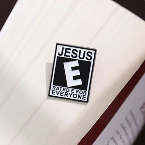 Hip-hop Jesus Enamel Pin with Rated E for Everyone badge on book background