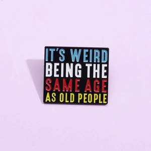 Square enamel brooch with humorous slogan It's Weird Being The Same Age As Old People