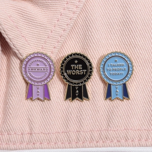 Set of three colorful geometric enamel award medals pins for apparel and bags