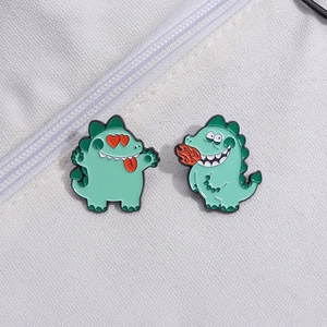 Lot de 2 pins dinosaures mignons en émail vert menthe sur fond en tissu blanc