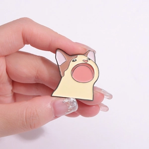 Cute cartoon Pop Cat enamel pin badge made of zinc alloy being held in hand