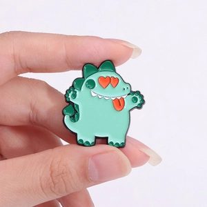 Broche dinosaure verte mignonne avec yeux en forme de cœur rouge pour décoration de vêtement