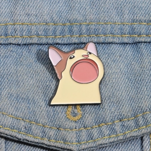 Funny Pop Cat enamel pin badge on blue denim jacket pocket for cute accessory look