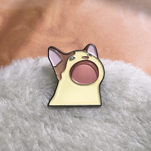 Funny Pop Cat enamel pin featuring an open mouth cat design on white faux fur background