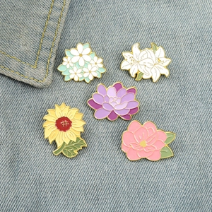 Five-piece cartoon enamel flower pins set with sunflower and lily on denim jacket