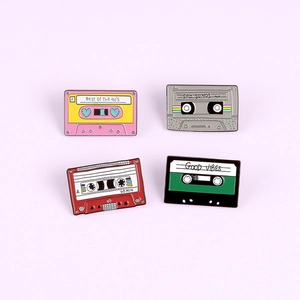 Vintage cassette tape enamel pins set with retro themes and heart patterns in various colors
