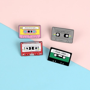 Set of four retro enamel cassette tape brooches with colorful 90s vintage designs