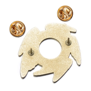 Detailed back view of gold metal Eye of Horus badge showing double pins and butterfly clutches