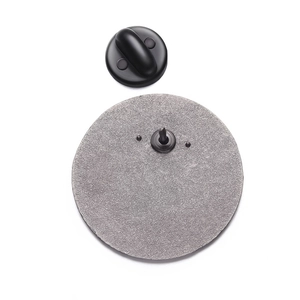 Detailed view of the circular metal badge back with a sturdy pin and black rubber clutch