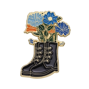 Floral hiking boot enamel pin with colorful lilies in polished metal finish