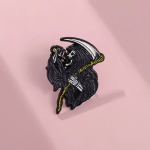 Gothic Grim Reaper enamel brooch with scythe drinking cocktail on pink background