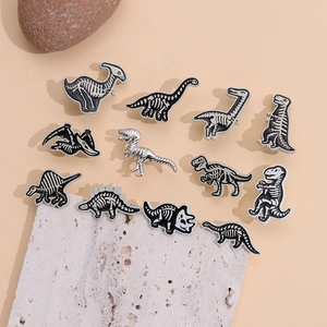 Cartoon punk dinosaur skeleton enamel pins set with fossil style metal badges for decoration