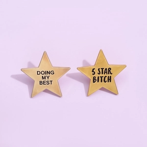 Golden star-shaped metal pins featuring 'Doing My Best' and '5 Star Bitch' printed text