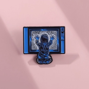 Retro TV enamel pin featuring a silhouette of a long-haired girl on a snow-pattern screen