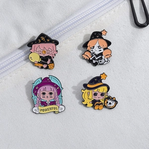 Detailed view of four colorful enamel pins featuring magical girls on a canvas bag