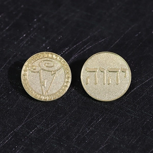 Golden geometric brooch pins featuring engraved lightning pattern and Hebrew inscription