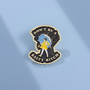 Funny enamel pin featuring a girl with umbrella and Don't be a salty bitch text