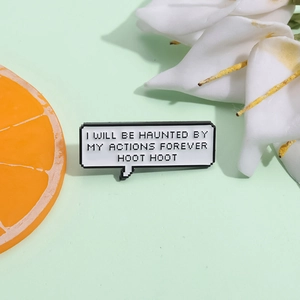 Macro view of pixel art enamel pin with I WILL BE HAUNTED BY MY ACTIONS FOREVER HOOT HOOT text
