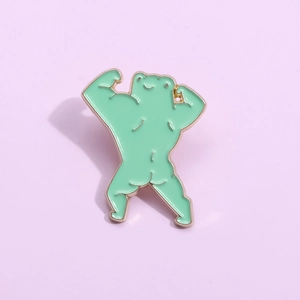 Creative green muscular frog enamel brooch with gold trim on lavender background