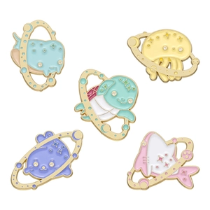Five-piece set of cartoon ocean animal enamel pins with space elements on white background