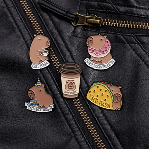 Set of 5 cute capybara enamel pins on a black leather jacket with fun pun designs