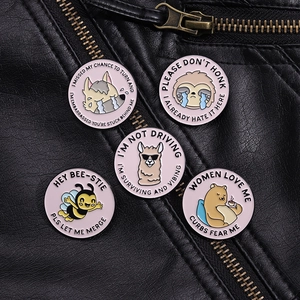 Pink cartoon enamel pins set featuring funny animals on a black leather background