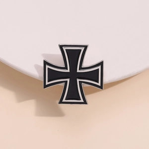 German Iron Cross brooch in black enamel with silver metal edges on a neutral background