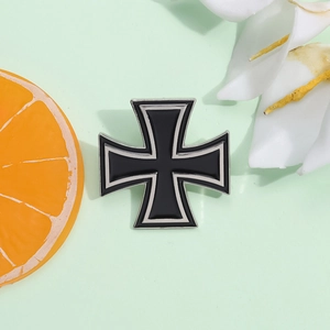 Macro shot of an Iron Cross brooch with black enamel inlay and polished silver edges
