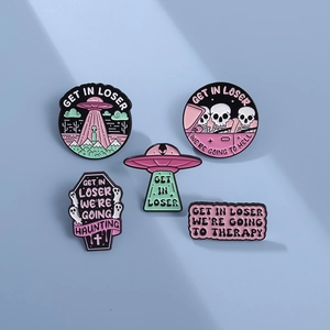 5-piece set of punk style alien UFO enamel pins in pink and green on blue background