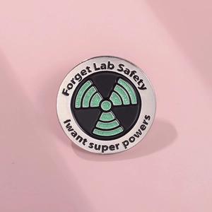 Green glitter radioactive symbol enamel pin with Forget Lab Safety I want super powers text