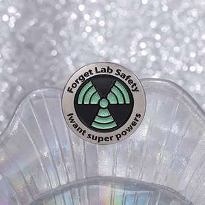 Forget Lab Safety round enamel pin with radioactive symbol and superpower quote