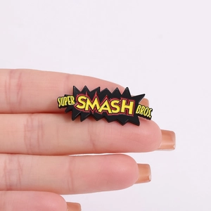 Enamel Super Smash Bros. metal badge pin for game fans with black and yellow logo