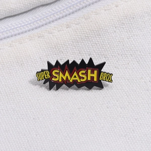 Macro shot of colorful Super Smash Bros enamel pin with comic style burst effect on canvas