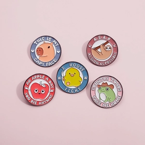Detailed close-up of 5 round cartoon animal enamel pins made of zinc alloy on pink surface
