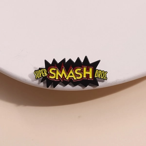 Zinc alloy enamel pin with Super Smash Bros text and comic explosion design
