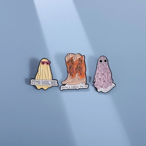 Three enamel pins set featuring a ghost, cowboy boot, and floral motif with song lyrics
